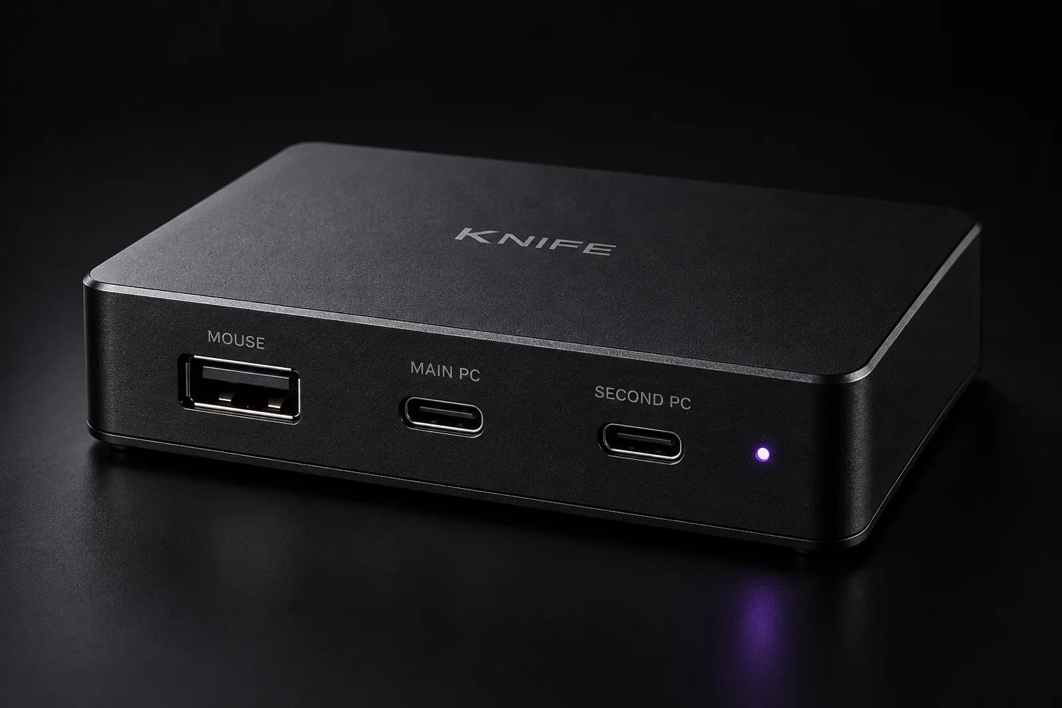 KNIFE in matte-black aluminum with MOUSE, MAIN PC and SECOND PC ports and a subtle violet status light.